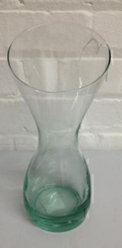 This beautiful clear glass waisted vase by Rayware is hour glass shaped and has an aesthetically pleasing look and would look great with flowers in. The waist in the vase make is perfect for holding hand tied bouquets. Size 30x10cm